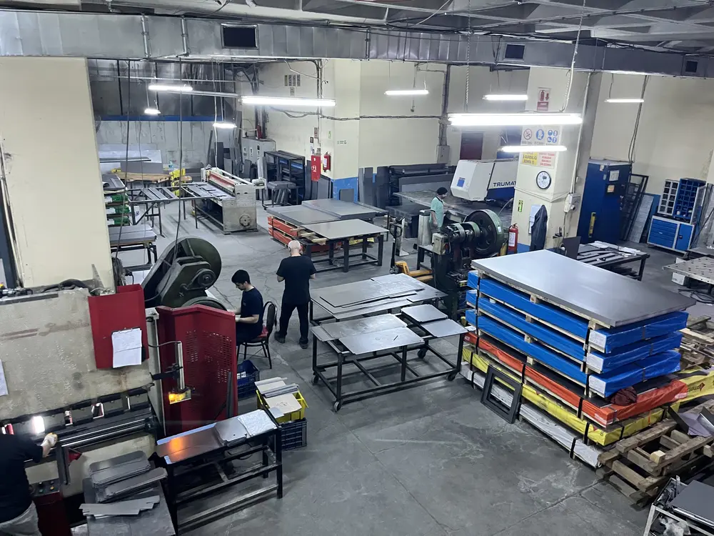 Steel being cut and bent for lockers on the production floor